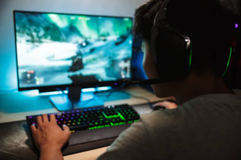 Is Worth It Pros Cons Boy Playing Video Games Online On Computer 768x512 